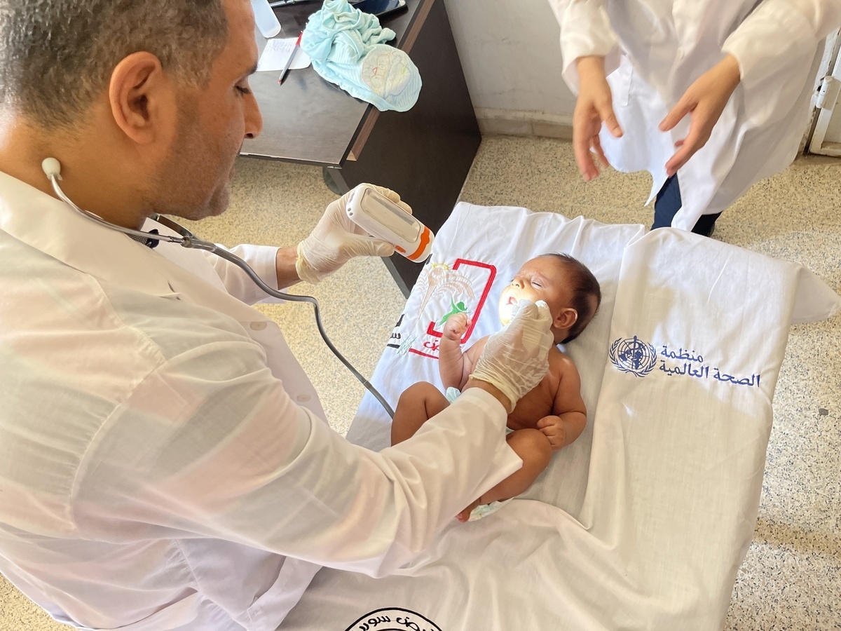 3-month baby receiving pediatric health services at WHO-supported health center in Deir-Ez-Zor, Syrian Arab Republic.