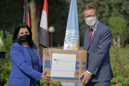 The German Ambassador to Egypt Frank Hartmann handed over a donation of 7 million masks to WHO, which were received by the WHO Representative to Egypt Dr Naeema Al Gasseer at the premises of the German Embassy in Egypt. The masks were donated by the German Federal Ministry of Health from its own stocks and will be distributed to medical facilities all over Egypt to help protect health care workers. - Title of WHO staff and officials reflects their respective position at the time the photo was taken. Read more: http://www.emro.who.int/egy/egypt-news/germany-donates-7-million-masks-to-who-to-help-protect-egyptian-health-care-professionals.html