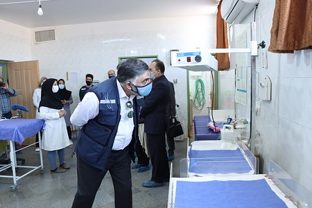 WHO Representative and Head of Mission to the Islamic Republic of Iran, Dr Syed Jaffar Hussain at a delivery and maternal services facility dedicated to the foreign population in the area to respond to the large population of Afghans in the province. WHO Scales Up Support to I.R. Iran in partnership with UNHCR for Providing Health Services to Afghan Refugees, Host Communities in Kerman Province The World Health Organization plans to give boost to its support to the Islamic Republic of Iran in delivering healthcare services to the Afghan community as well as the hosting population in the country, orchestrated in collaboration with UNHCR and other local partners and in light of the recent developments in neighboring Afghanistan which has spurred a new influx of refugees into the country. The decision was announced by WHO Representative and Head of Mission to the Islamic Republic of Iran, Dr Syed Jaffar Hussain, who visited the southern Kerman Province in close proximity to the Iran-Afghanistan border on Wednesday, 27 October, at the head of a WHO delegation of technical experts and met with local and provincial authorities of Kerman University of Medical Sciences. The refugee-exclusive vaccination centre in Sharafabad, a densely Afghan-populated district in Kerman, provides COVID-19 immunization services to 400-500 Afghan nationals on a daily basis regardless of their legal status. The visitors get a choice between the Chinese vaccine Sinopharm, and the Indian jab COVAXIN, donated by the government of India. Refugees under 18 years of age are also inoculated using Sinopharm at this centre. Visitors also get vaccine-related health information in the form of brochures before and after vaccination. The current Afghan refugee crisis comes on top of millions of Afghan refugees already in neighboring countries. Iran has been hosting Afghan refugees since 1979, and according to UNHCR, there are between 3 and 3.5 million Afghans in Iran. Nearly one million are considered to be de facto refugees, about half a million have Iranian visas, and the rest are considered to be undocumented. On his mission to Kerman, Dr Hussain also met with local and provincial authorities of Kerman University of Medical Sciences and paid a visit to the Research Institute of Future Studies in Health and the Stem Cells and Regenerative Medicine Comprehensive Center, both affiliated to the Kerman University of Medical Sciences. Read more: http://www.emro.who.int/iran/news/who-scales-up-support-to-islamic-republic-of-iran-in-partnership-with-unhcr-to-provide-health-services-to-afghan-refugees-host-communities-in-kerman-province.html - Title of WHO staff and officials reflects their respective position at the time the photo was taken.