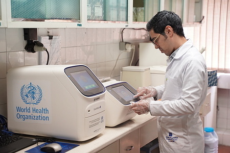 Technicians at work at the National Polio Laboratory of the Islamic Republic of Iran.  World Health Organization (WHO) has been supporting the laboratory by providing equipment and consumables. 