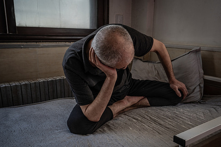 Former Aleppo resident Anaas, who is 72 years old, sits on a bed at the Ruh Sagligi Mental Health Hospital in Azzaz in Northwest Syria. Anaas was transferred from Aleppo in 2014 and is one of the 60 full-time patients at the facility.