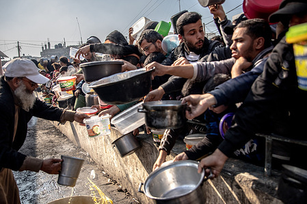 Internally Displaced Palestinians waiting in line for food at Al-Shaboura camp, in the center of Rafah, southern of Gaza strip.