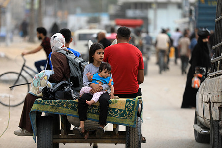 Palestinians are fleeing Khan Younis on donkey carts loaded with belongings in search for safety in t he southern town of Rafah.  